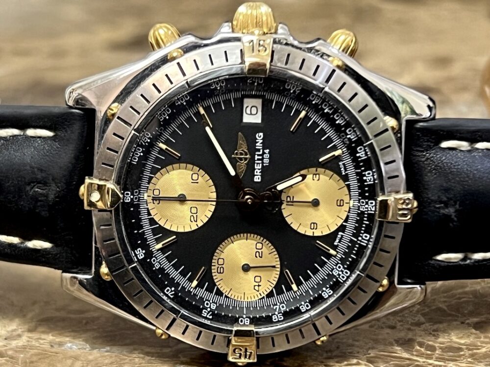 Breitling Chronomat 18k Gold / Steel automatic 40.5mm Black and Gold Dial Black Leather B13047