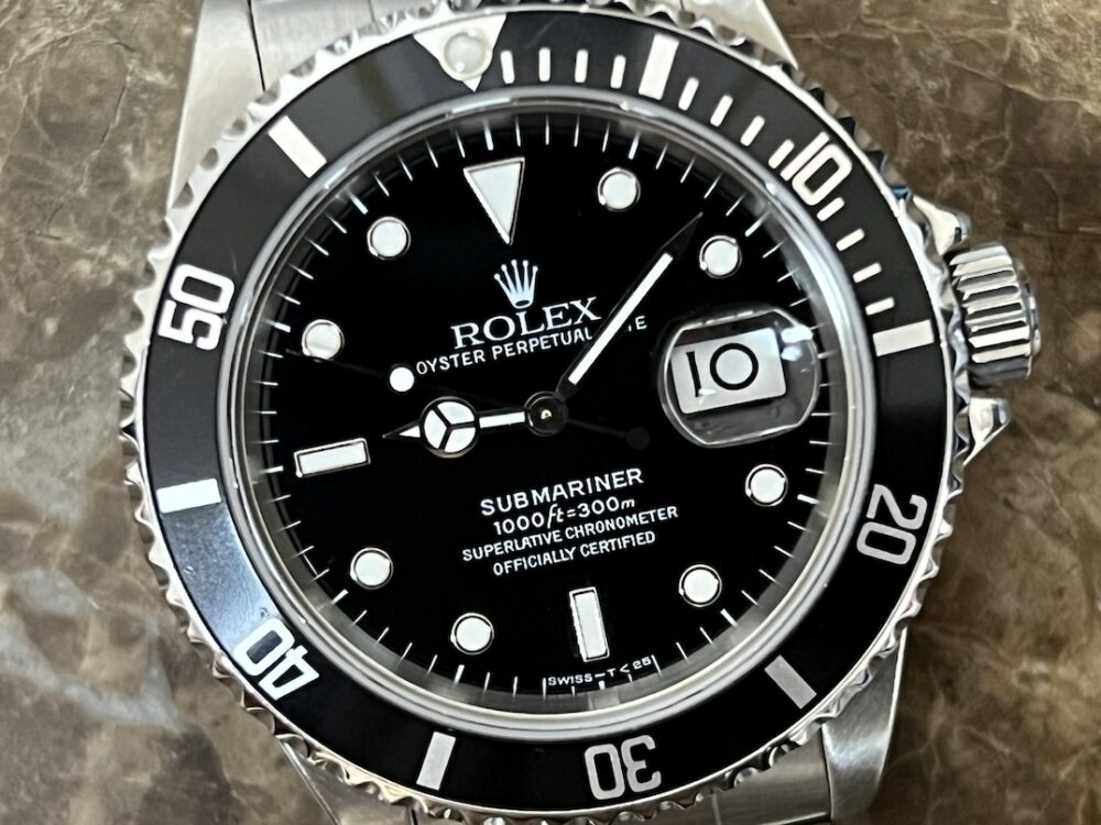 Rolex Submariner Date with Black Dial Black Bezel 40mm Automatic with Box and Rolex Service Card 16610