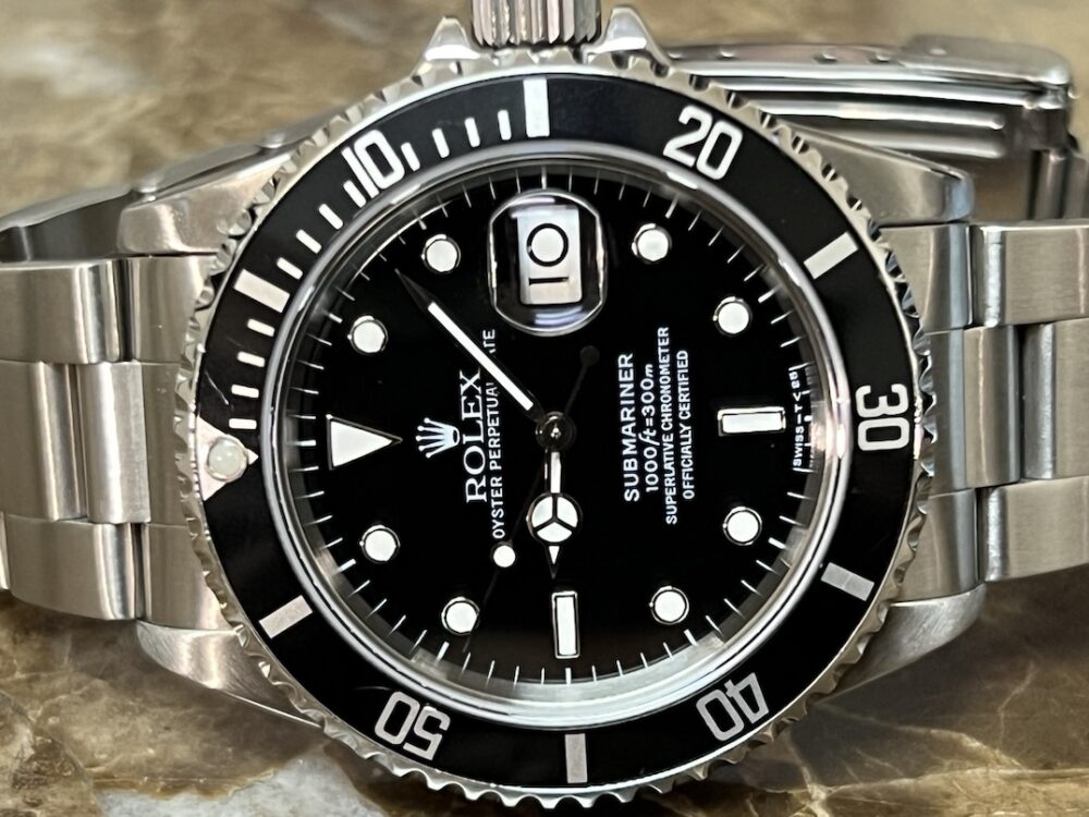 Rolex Submariner Date with Black Dial Black Bezel 40mm Automatic with Box and Rolex Service Card 16610