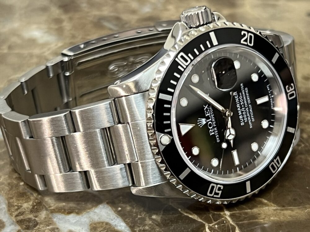 Rolex Submariner Date with Black Dial Black Bezel 40mm Automatic with Box and Rolex Service Card 16610