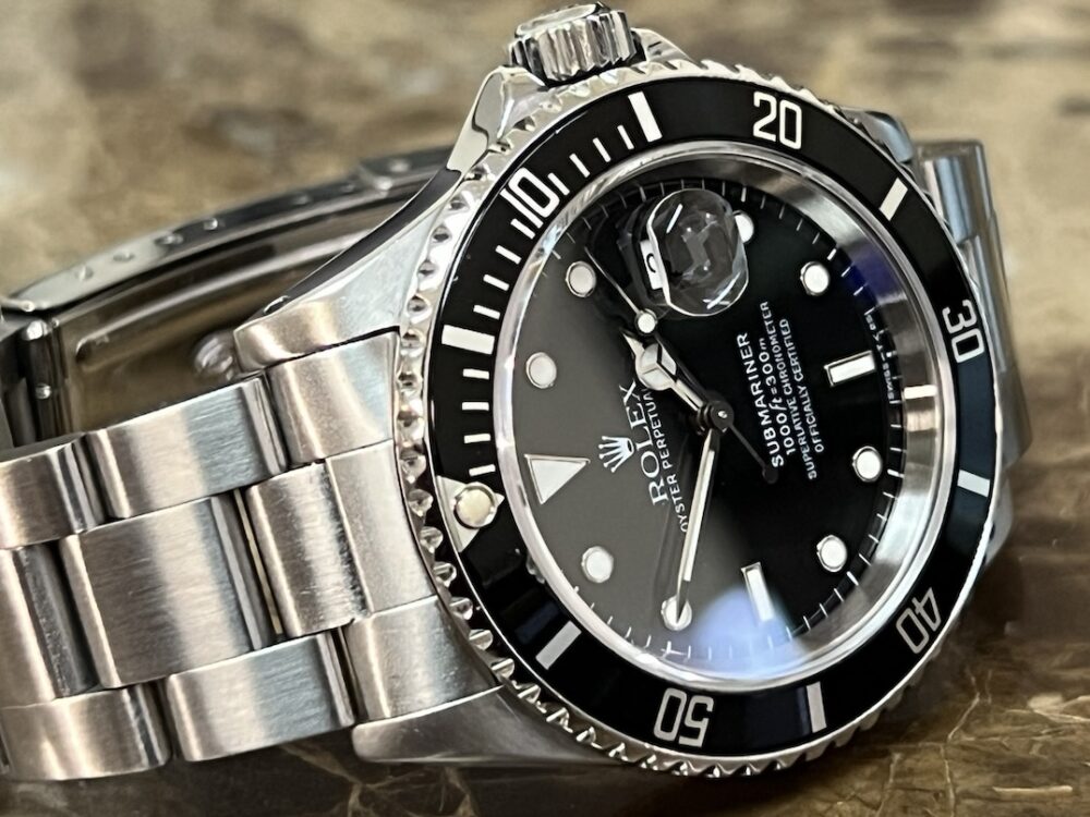 Rolex Submariner Date with Black Dial Black Bezel 40mm Automatic with Box and Papers 16610