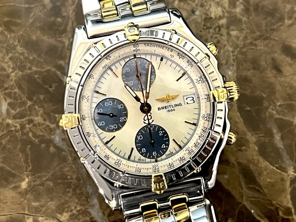 Breitling Chronomat 18k Gold / Steel automatic 40.5mm White Mother of Pearl Dial with Blue Subs and 18k Gold and Steel Bracelet B13050.1