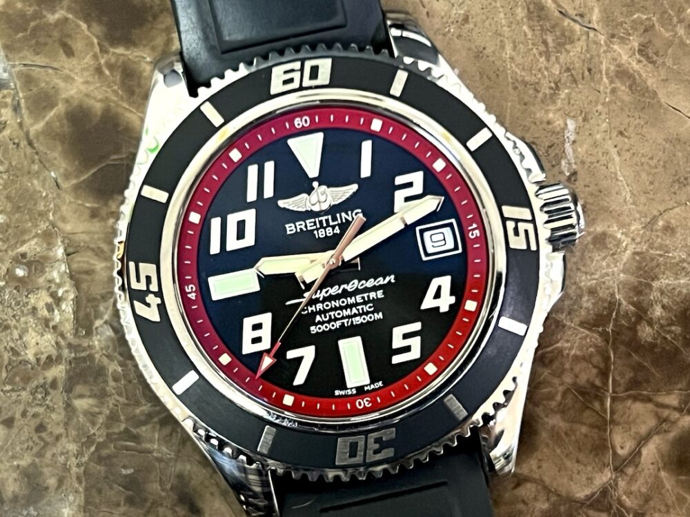 Breitling SuperOcean 42 model A17364 Automatic Black Dial Red inner bezel ring on a Rubber Dive strap with Breitling Travel Box