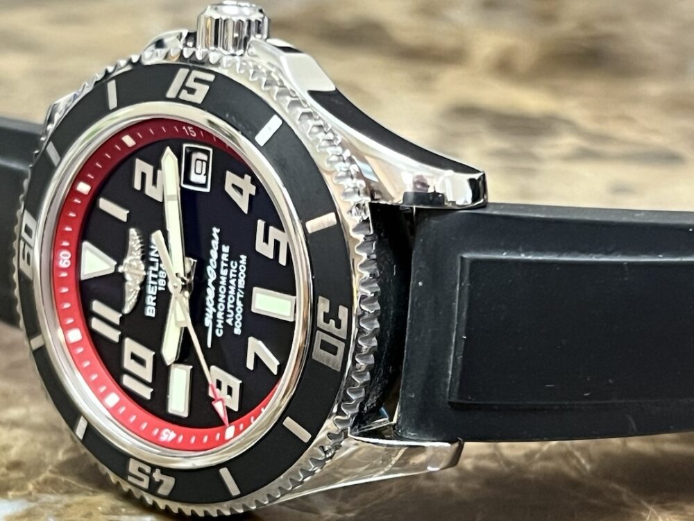 Breitling SuperOcean 42 model A17364 Automatic Black Dial Red inner bezel ring on a Rubber Dive strap with Breitling Travel Box