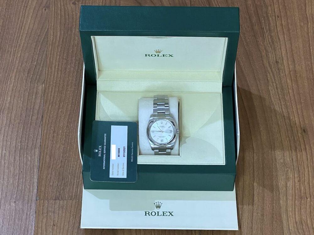 Rolex Oyster Perpetual 36mm Automatic Silver Dial model 116000 with Box and Service Card