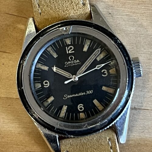 Omega SEAMASTER 300 Vintage Bakelite Bezel 39mm Automatic Caliber 550 with heavy matching patina 165.014-63 year 1963