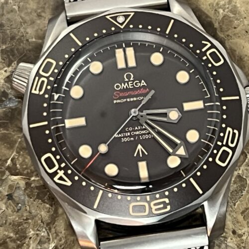 Omega SEAMASTER 300M 007 Edition Titanium Automatic 42mm Brown Dial Ceramic Bezel with Bracelet Box Papers Cards 210.90.42.20.01.001