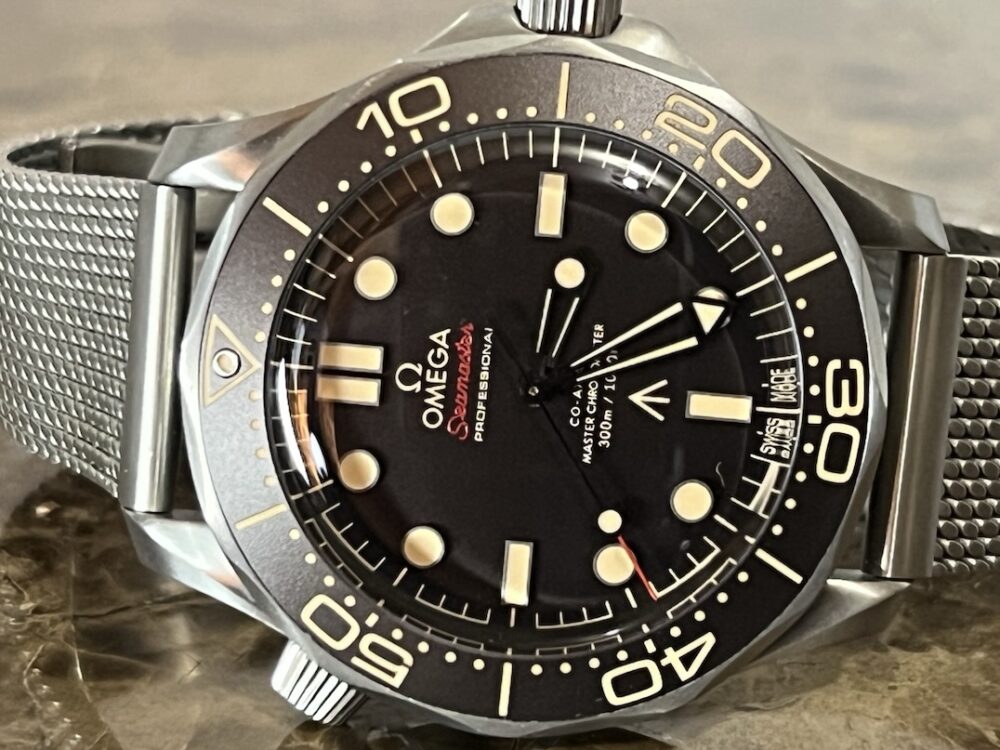 Omega SEAMASTER 300M 007 Edition Titanium Automatic 42mm Brown Dial Ceramic Bezel with Bracelet Box Papers Cards 210.90.42.20.01.001