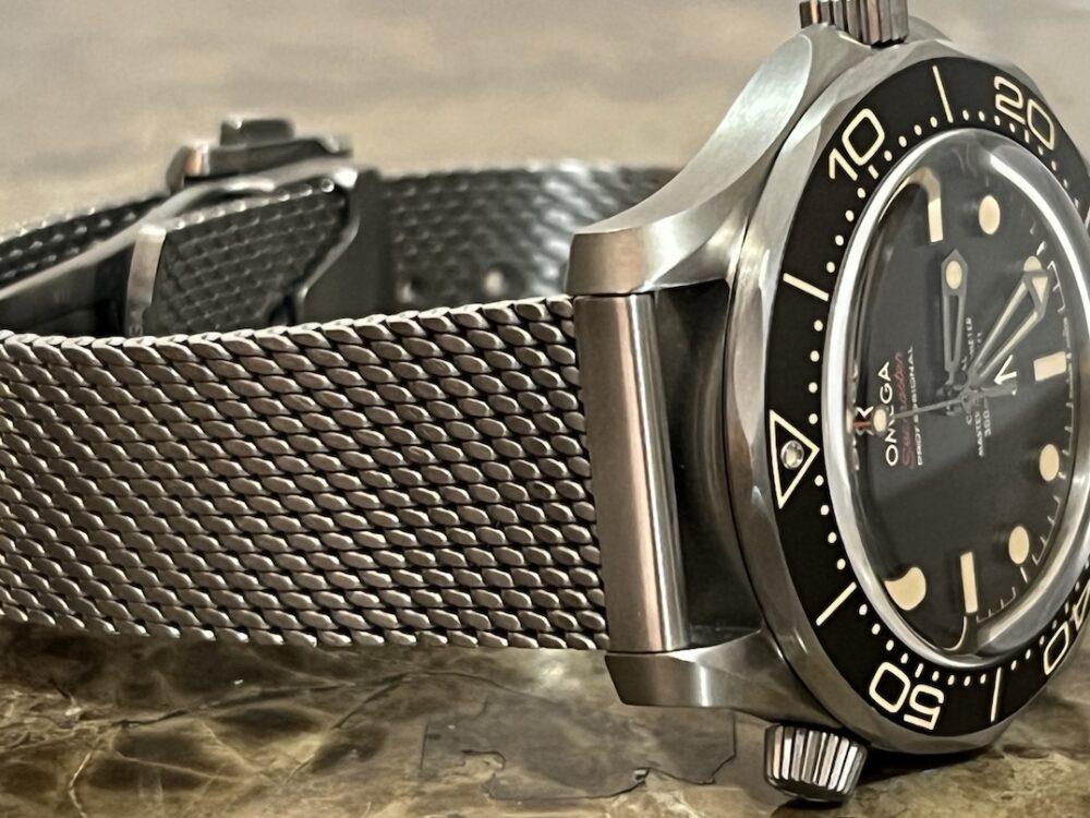 Omega SEAMASTER 300M 007 Edition Titanium Automatic 42mm Brown Dial Ceramic Bezel with Bracelet Box Papers Cards 210.90.42.20.01.001