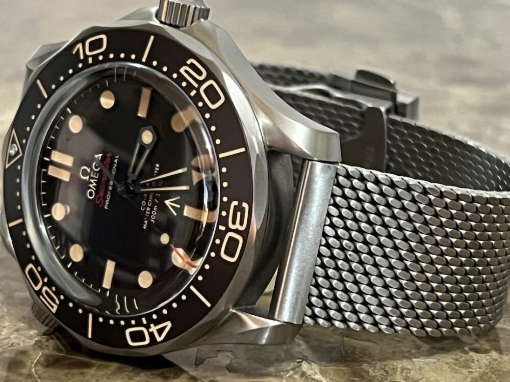 Omega SEAMASTER 300M 007 Edition Titanium Automatic 42mm Brown Dial Ceramic Bezel with Bracelet Box Papers Cards 210.90.42.20.01.001