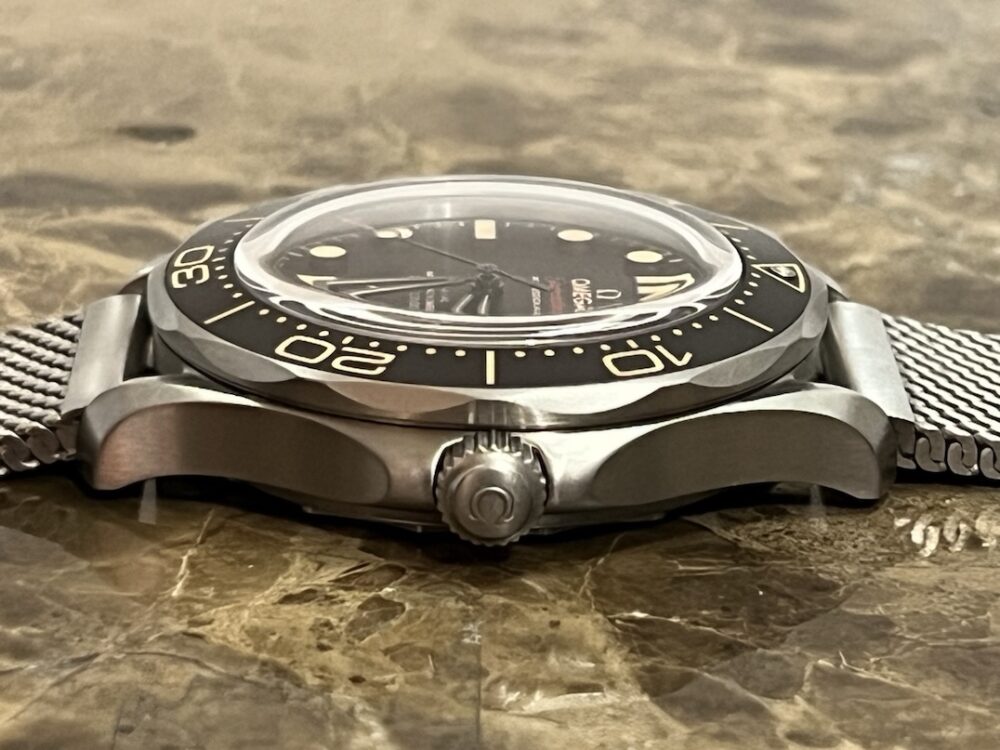 Omega SEAMASTER 300M 007 Edition Titanium Automatic 42mm Brown Dial Ceramic Bezel with Bracelet Box Papers Cards 210.90.42.20.01.001