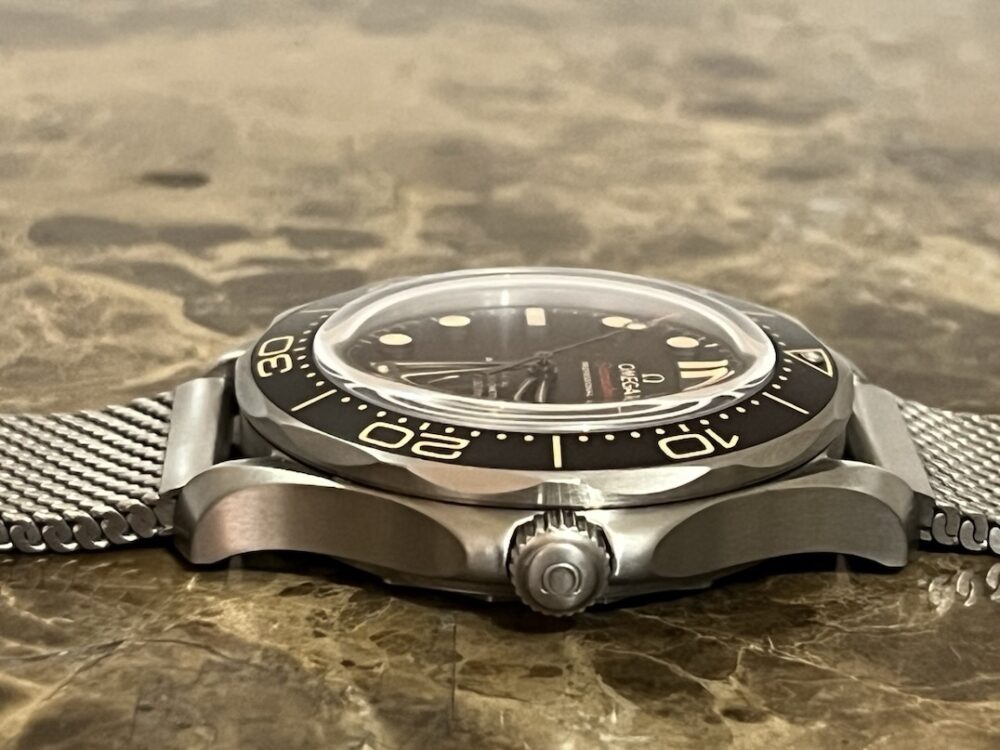 Omega SEAMASTER 300M 007 Edition Titanium Automatic 42mm Brown Dial Ceramic Bezel with Bracelet Box Papers Cards 210.90.42.20.01.001