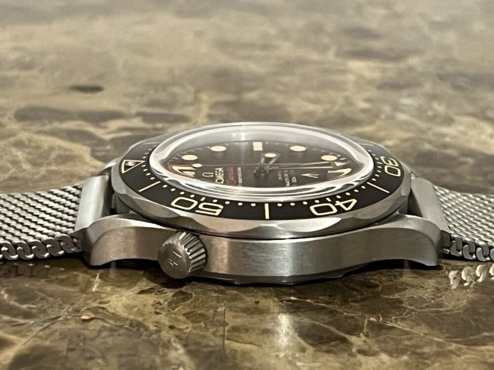 Omega SEAMASTER 300M 007 Edition Titanium Automatic 42mm Brown Dial Ceramic Bezel with Bracelet Box Papers Cards 210.90.42.20.01.001