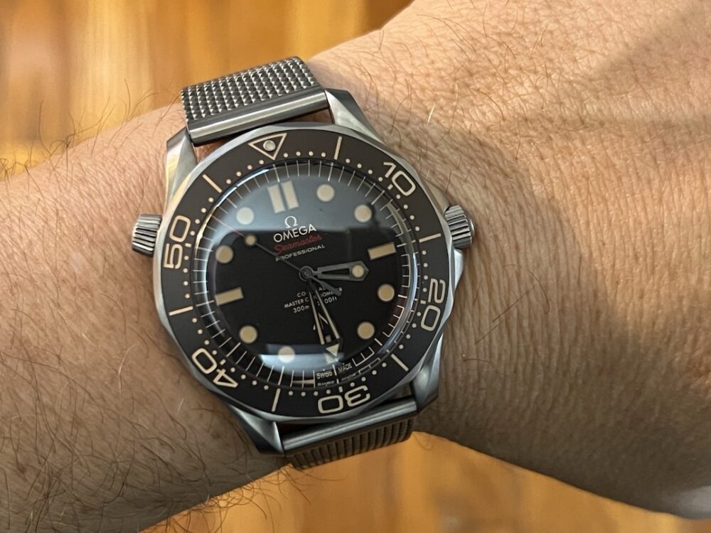 Omega SEAMASTER 300M 007 Edition Titanium Automatic 42mm Brown Dial Ceramic Bezel with Bracelet Box Papers Cards 210.90.42.20.01.001