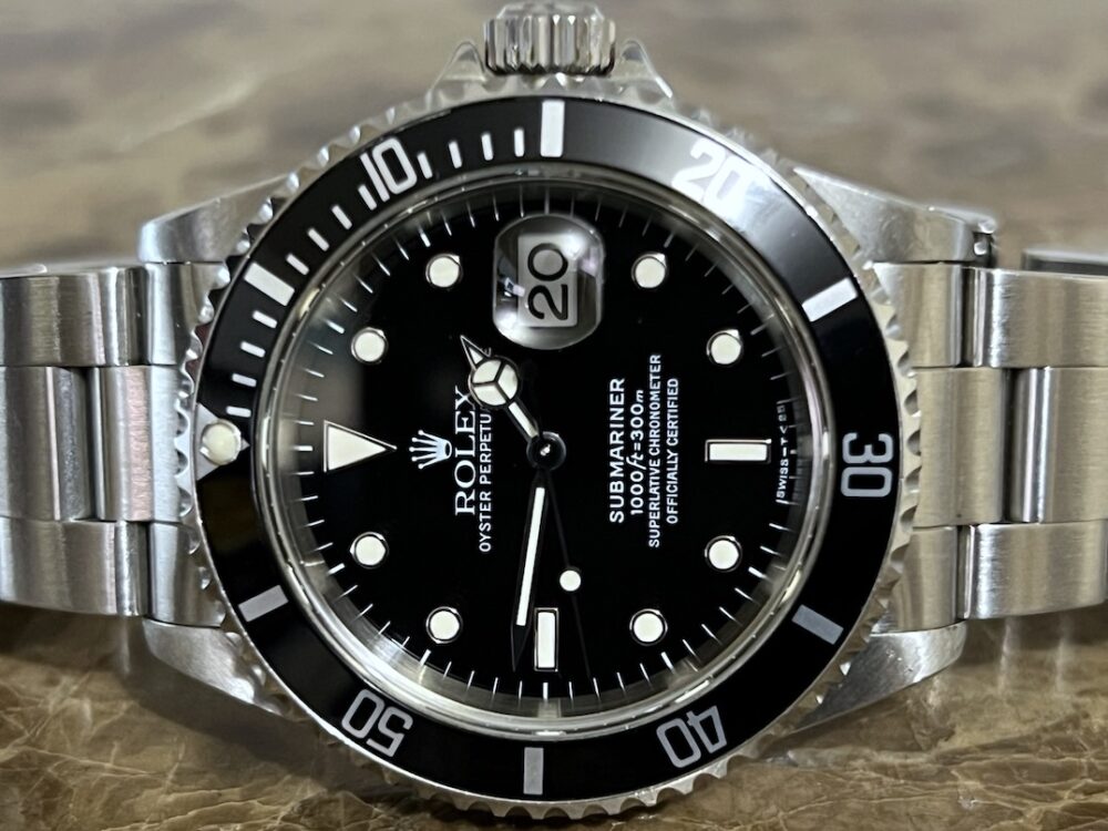 Rolex Submariner Date with Black Dial Black Bezel 40mm Automatic with Box and Papers 16610