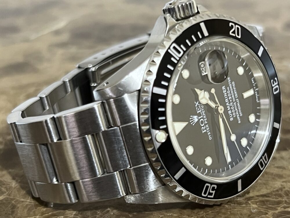 Rolex Submariner Date with Black Dial Black Bezel 40mm Automatic with Box and Papers 16610