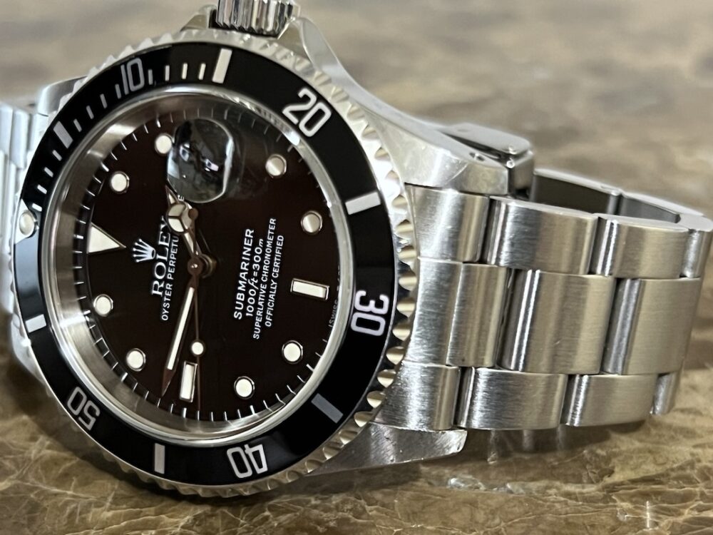 Rolex Submariner Date with Black Dial Black Bezel 40mm Automatic with Box and Papers 16610