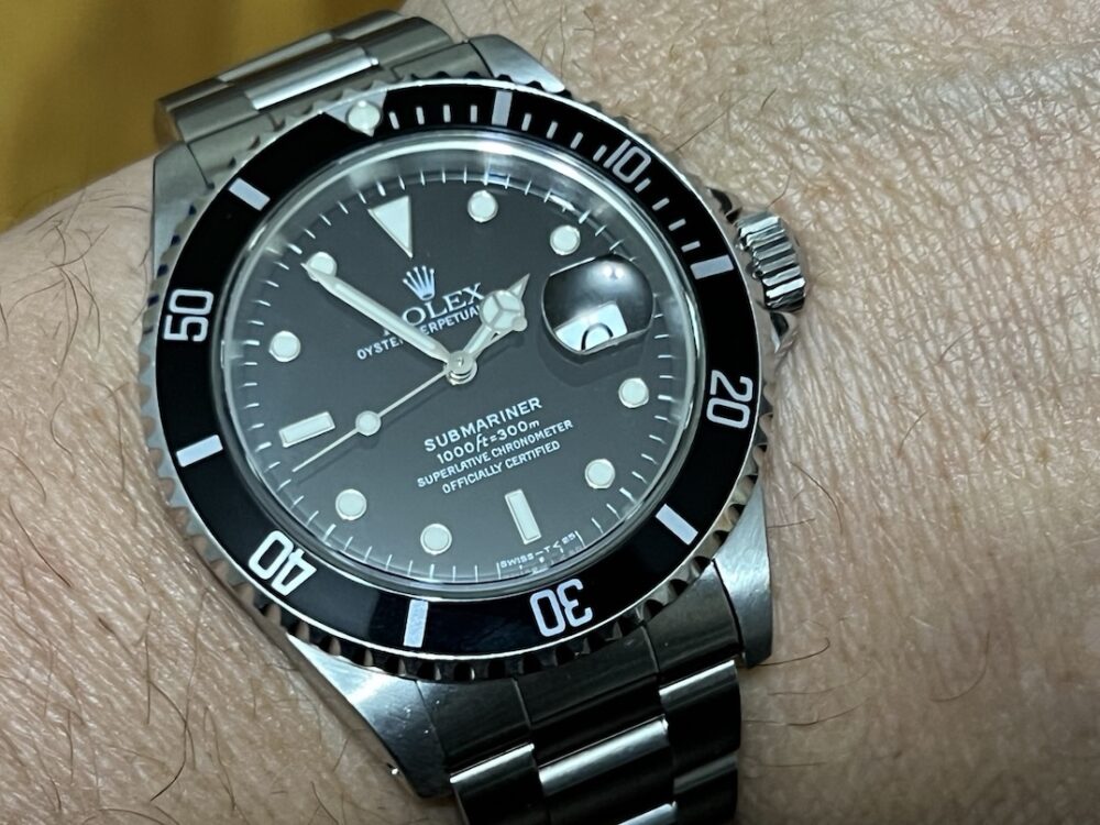 Rolex Submariner Date with Black Dial Black Bezel 40mm Automatic with Box and Papers 16610